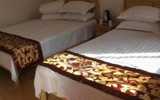 石岭镇邮政局附近哪里能住宿？